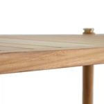 Close-up of smooth teak wood edge and slatted surface of the coffee table
