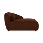 Side profile highlighting the sofa's rounded form and low black legs