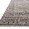 Low angle view of rug’s edge showing subtle pile height and colorful border design