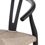 Close-up showing woven seat edge and black teak frame support bars