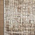 Close-up of Wyatt Clay / Smoke Rug corner on wooden floor showing weave and edge detail