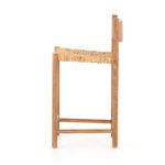 Side profile highlighting seat thickness and backrest profile of the stool