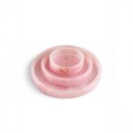 Stacked set of three pink alabaster trays showing varied sizes and veining patterns