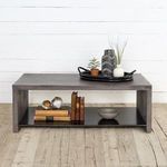 Hugo Coffee Table styled in living room with brown leather sofa, artwork and side table