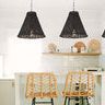 Three black rattan bell-shaped pendants hanging over contemporary kitchen island with wicker chairs