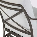 Close-up of chair’s rear X-frame detailing and white back cushion fabric texture