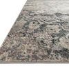 Close-up low angle showing edge and texture of the rug with subtle colored speckles