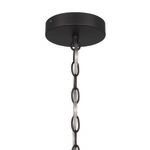 Close-up of ceiling mount and black metal chain links for hanging pendant