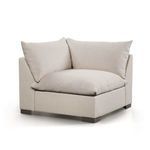 Alternate corner angle showing cushion layering and dark wood feet contrast