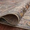 Close-up of Rosemarie rug pile rolled to show layered polypropylene and polyester fibers