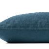 Side profile view showing smooth solid dusky blue cotton back of the pillow