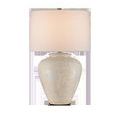 Mimi Ivory Table Lamp front view with softly diffused light showing the glow of the shade and ceramic base