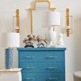 Back view of Greenwich Ceramic Lamp placed on a blue chest of drawers with gold mirror and sconces in room setting