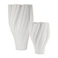 Pair of white twisted ribbed porcelain vases with the smaller vase stepped forward on the right side