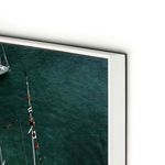 Close-up of the artwork edge highlighting the thin white frame and glossy finish on the aluminum print