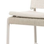 Close-up of side view showing how backrest fabric folds over top of aluminum frame tubing
