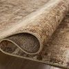 Close-up of Heritage Bark Multi rug folded to show the thickness and dense, plush texture.