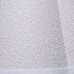 Close-up showing textured natural raffia material with visible linen trim on scalloped lamp shade