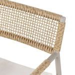 Zoomed view of the woven rope armrest wrapping around taupe chair frame
