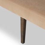 Close-up angled detail of seat cushion to backrest transition with soft velvet fabric