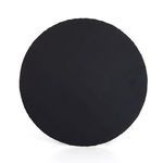 Bright open living room with wood and black metal furniture, including black tripod end table