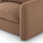 Close-up showing seam detail and padding on front corner of sofa arm