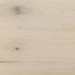 Close-up of light-washed poplar wood grain with natural knots and subtle color variations