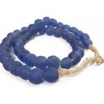 Close-up of deep blue vintage sea glass beads showing round frosted texture and natural fiber cord wrapping