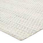 Close-up corner view highlighting handwoven polyester yarn and textured trellis pattern