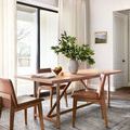 Heidi Dove Blush Rug styled under a dining table with leather chairs in a bright, modern room