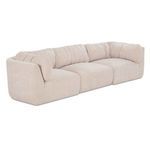 Matina Modular Sofa angled view showing rounded armrest and gathering in cushion fabric