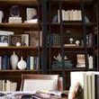 Side close-up showing natural wood finish shelf inside the Ivy Bookcase with iron pipe supports