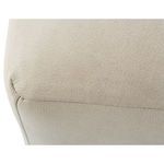 Close-up of beige leather ottoman upholstery seam and texture