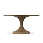 Straight-on side view of table highlighting tulip base silhouette and round tabletop.