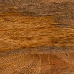 Close-up texture of mango wood grain showing natural variations and warm tones