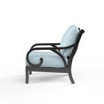 Side profile of Monterey Club Chair showing scroll arm detail and light blue cushions