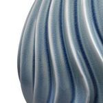 Close-up of wavy ceramic blue glaze showing textured crackle finish on lamp body