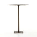 Side profile view showing table's slender round top and central pedestal