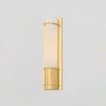 Tottenville Wall Sconce shown mounted on a light gray wall in ambient room setting