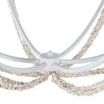 Close-up of the central metal hub where six curved rods meet on the Nakita Chandelier with stone bead strands attached