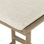 Macro shot of tightly woven outdoor Olefin fabric on cushion in beige tones