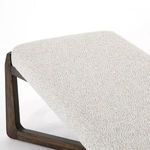 Close-up of the top surface of the seat upholstery showing soft pebble texture in light neutral tones