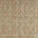 Zoomed-in top view highlighting detailed hand-knotted Berber diamond patterns on taupe background