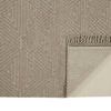 rug corner flipped up revealing solid beige woven backing and detailed fringe border