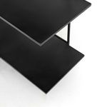 Top view close-up of black distressed iron shelves showing their layered design