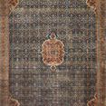 Layla rug with cobalt blue field and spice-colored medallions, traditional vintage design with intricate floral motifs