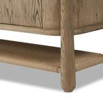 Corner of sideboard showing wood panel texture and rounded frame edge wrapping around corner