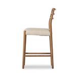Side profile highlighting the tall ladderback slats and footrest details of the counter stool