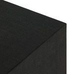 Detail view inside cabinet of black metal wine glass holder mounted under top interior panel