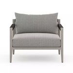Front view showing wide cushioned seat and back with weathered grey teak frame and black armrest wraps